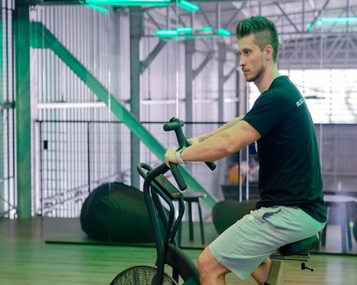Person doing light cardio on a stationary bike